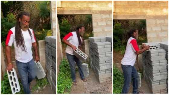 54-year-old Portuguese Ghanaian farmer carries his own blocks to build his house