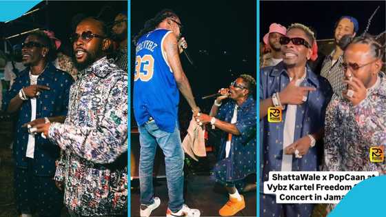 Shatta Wale smiles brightly as Popcaan speaks to him in heavy patois