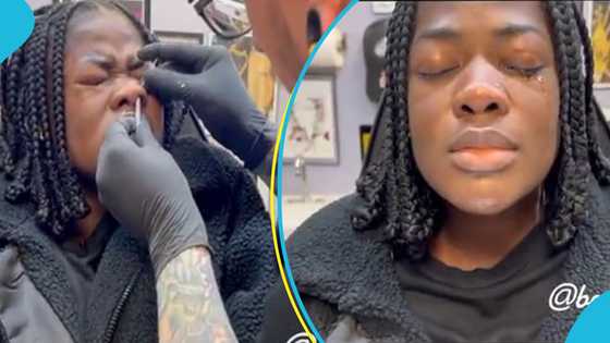 Asantewaa cries and screams as she re-pierces her nostrils in New Jersey in the US