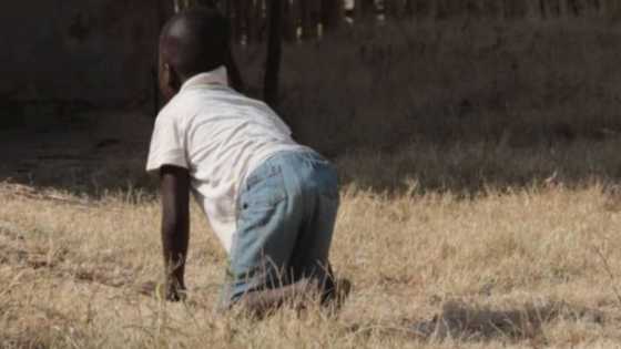 Meet the Ghanaian boy who walks with both hands and legs; sleeps on the floor at home