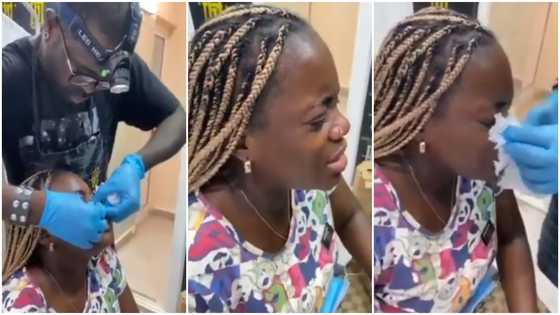 Daring lady screams and cries as she gets nose piercing in emotional video; peeps ask who sent her