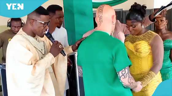 Ghanaian bride and her heavily-tattooed 'obroni' husband's wedding videos go viral!