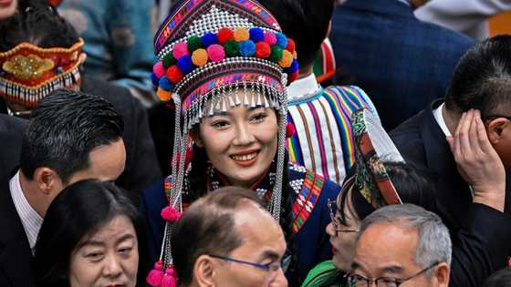 China's elite don traditional garb for annual 'Two Sessions' talking shop