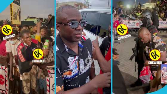 Shatta Wale’s manager Sammy Flex shares drinks and water to fans after his release from EOCO