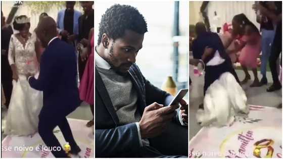 Overjoyed groom jumps into bride's arms forgetting he's not a baby, they both land heavily on the floor