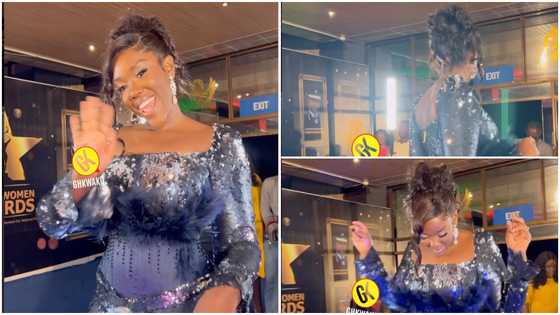 Stonebwoy's wife: Dr Louisa looks regal in a black shiny gown to receive an award at the Ghana Women Awards