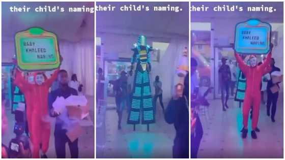 Parents turn their child's naming ceremony into a club as they party with fog & masquerade in video