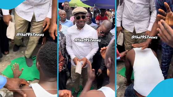 NPP supporter removes shirt and lays it on the floor for Afenyo-Markin to walk over it