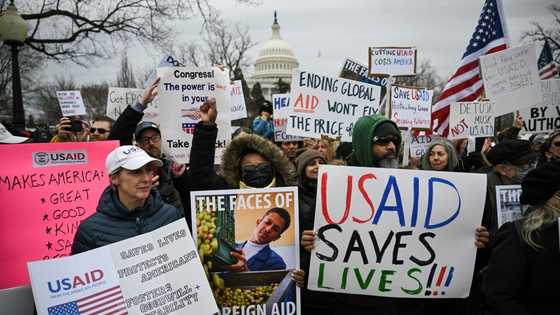 US federal workers weigh Trump buyout as court to step in