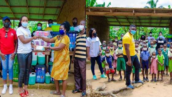 Ghanaian lady & team bless primary school with COVID-19 preventive items and stationery