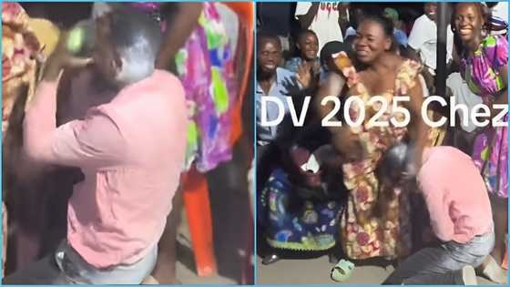 Market women pour powder on a man who won the US visa lottery