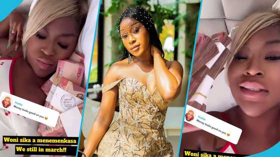 Efia Odo sleeps in a pool of GH¢200 money bundles, video causes a stir on social media