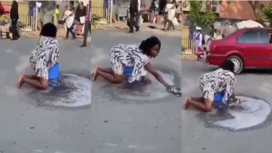 Video of woman washing a road with soap and water goes viral; Ghanaians react