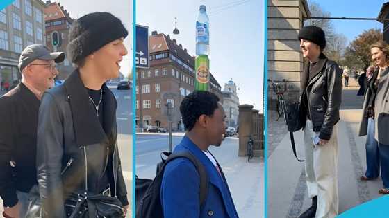 Mr Happiness draws crowds as he walks Copenhagen's streets with bottles balanced on head