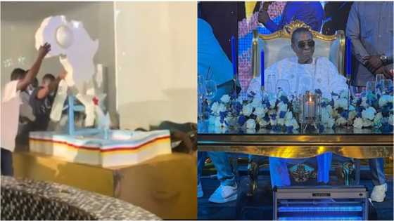 Video of over 6 men pushing Safo Kantanka's African map themed birthday cake pops up