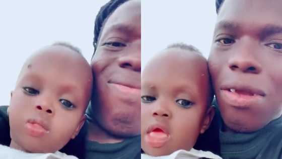 Shatta Bandle poses with cute son in new video,netizens say "No DNA needed"