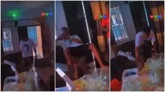 Man stays unimpressed as girlfriend throws him surprise birthday 'party', he keeps pressing phone in video