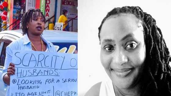 Beautiful frustrated woman hits the streets with placard in search of husband