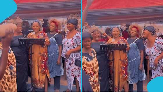 Ghanaian yam sellers read a tribute in English to their dead colleague, amaze many