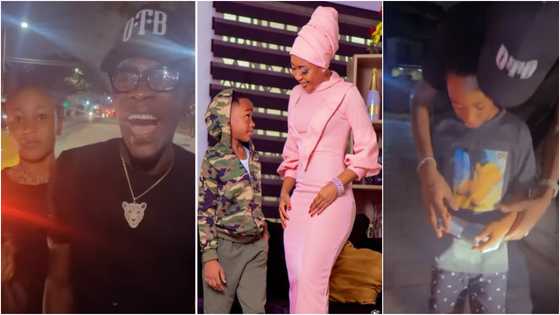 Shatta Wale kisses Akuapem Poloo; gifts her son GHc500 in touching videos