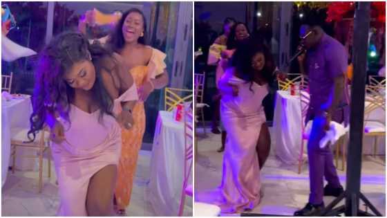 Curvy lady in dress with high slit turns heads with wild dance moves, slaying video causes stir