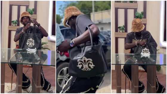 Black Sherif dabs lips with tissue, flaunts lady's handbag in video: "Lip gloss was too much for him"