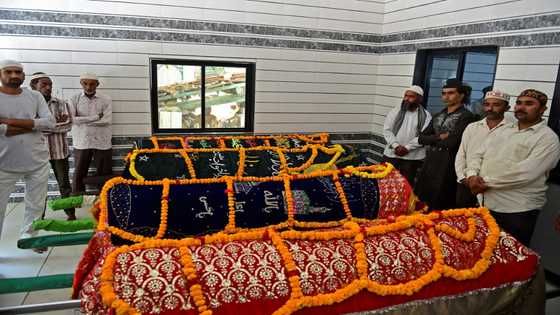 Families line up to bury dead from India bridge collapse