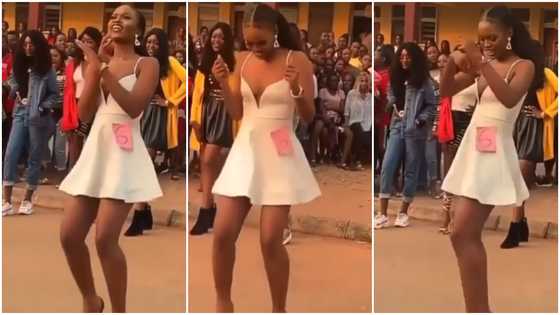 Pretty lady in heels shows off dance moves and fine legs during competition, her audience shout in video