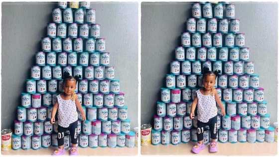 Mum posts photo of her baby and cans of milk she consumed, image goes viral; "87 tins of milk in 12 months"
