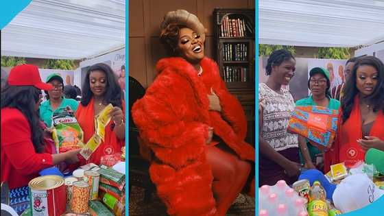 Jackie Appiah hands out food items and souvenirs to reward her community members at her birthday party