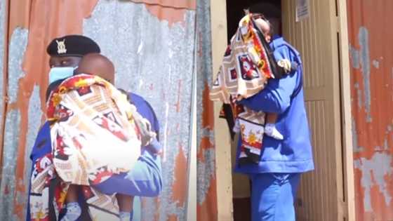 Policeman warms hearts as he babysits child of woman while she sits for exam; cute photos pop up