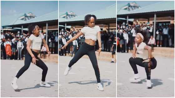 She's flexible: Young girl in crop top shows hot moves with legs apart as she dances before students in video