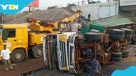 Cargo truck from Burkina Faso overturns on Circle overhead, crushes sprinter bus