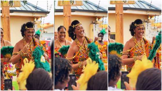 Ghanaian bride with golden skin and beautiful white smile dances in gorgeous Kente