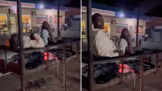 Video of man lying on burning coals to keep warm in winter leaves many with mixed feels