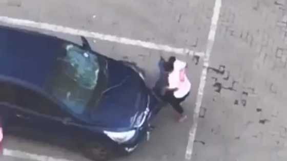 Strong lady angrily destroys lover's car with her bare hands; video causes stirs