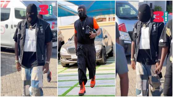 Medikal causes massive stir, wears heavy jacket & ski mask in blazing sun