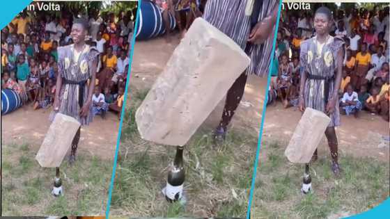 Ghanaian student in Volta Region suspended building block on top of a bottle during school cultural day