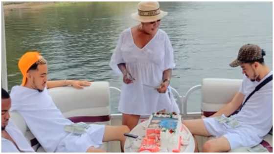 Afia Schwar captured on video spraying dollars on her twins to mark their birthday