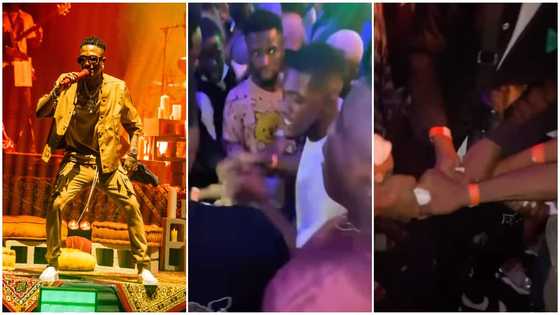 Video of grown men fighting 'gidigidi' for ownership of Wizkid's sweaty towel pops up