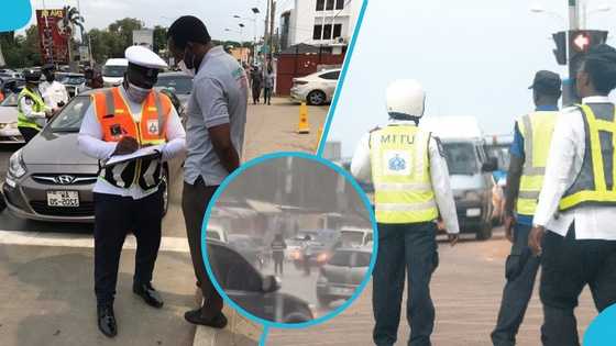 Police officers win hearts for what they did during downpour in Accra, video