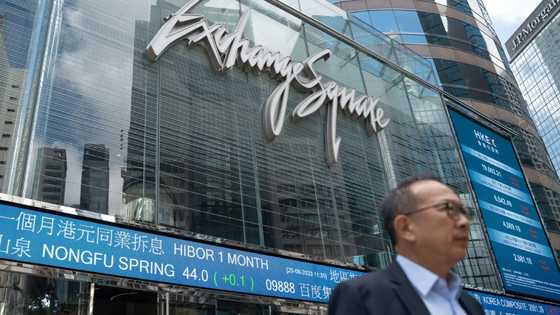 Asian stocks drop after Fed warning, oil dips with Mideast in focus