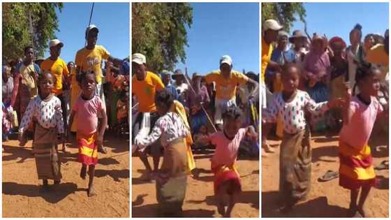 Little girl gives lovely leg moves, dances barefooted on street, leaves adults screaming in video