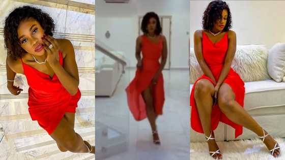 Lady in red: Becca flexes her beauty as she shows off her plush living room in video and photos