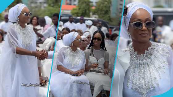 Alhaji Asoma Banda's wife looks flamboyant in a glittering white gown and stylish sunglasses at his funeral