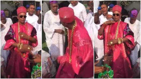 Nigerian king Oniba of Iba causes stir as he steps out in big gold chains on his wrists & neck, dances in clip