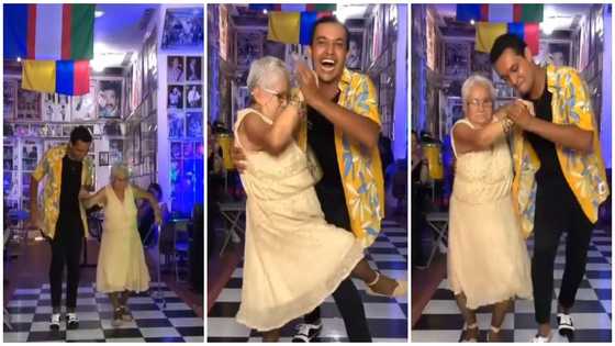 Old woman drops walking aid shows off legworks as she dances with young man