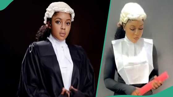 Young lady shows her sister who achieved first class from law school