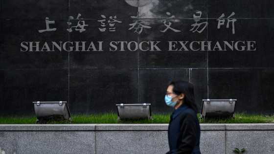 Asian markets mixed as traders await rate decisions