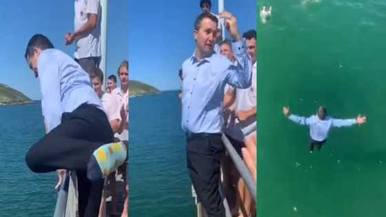 Teacher caught on tape playing with his students, jumps into river fully dressed, children scream & cheer